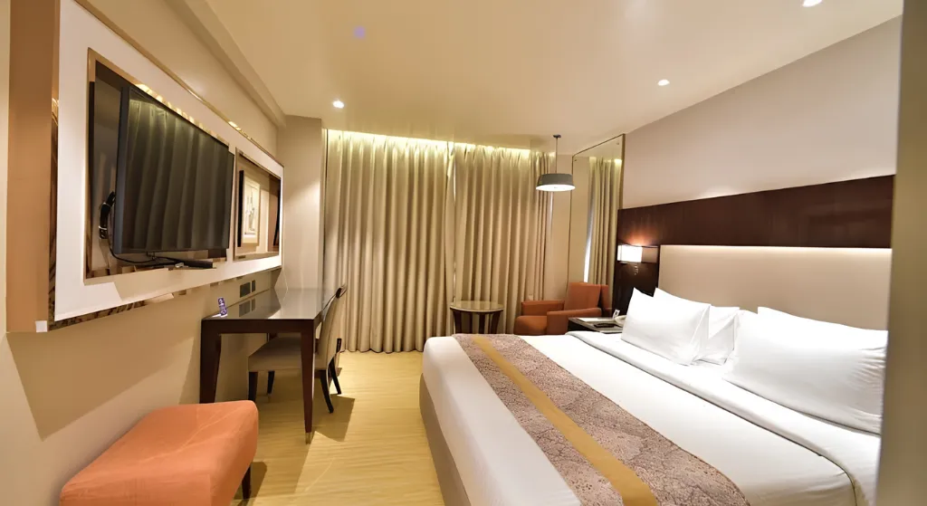 Modern luxury hotel room included in the char dham yatra by helicopter 2026 cost.