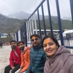 Happy pilgrims with tilaks smiling picture at Kedarnath helipad during their Chardham helicopter Package.